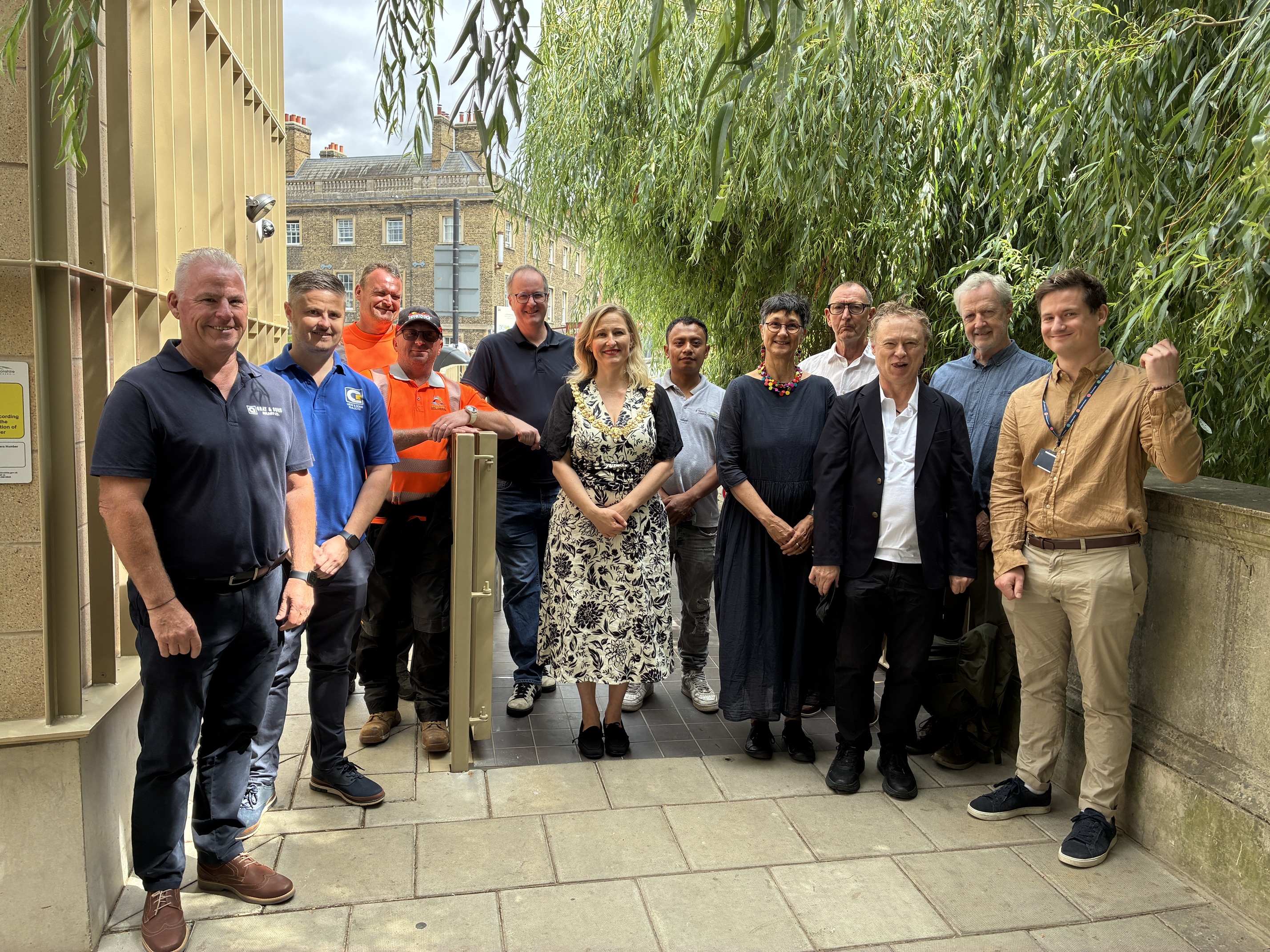 A group of people at the opening of Silver Street public toilets in Cambridge