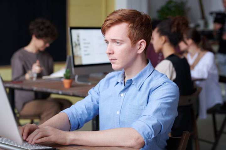 Young employee using a laptop