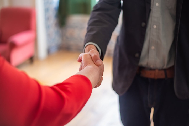 A man and woman shaking hands